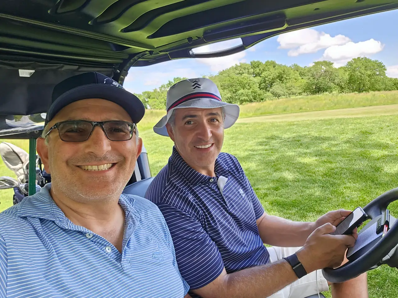 The Perry Bros in the cart at ArborLinks