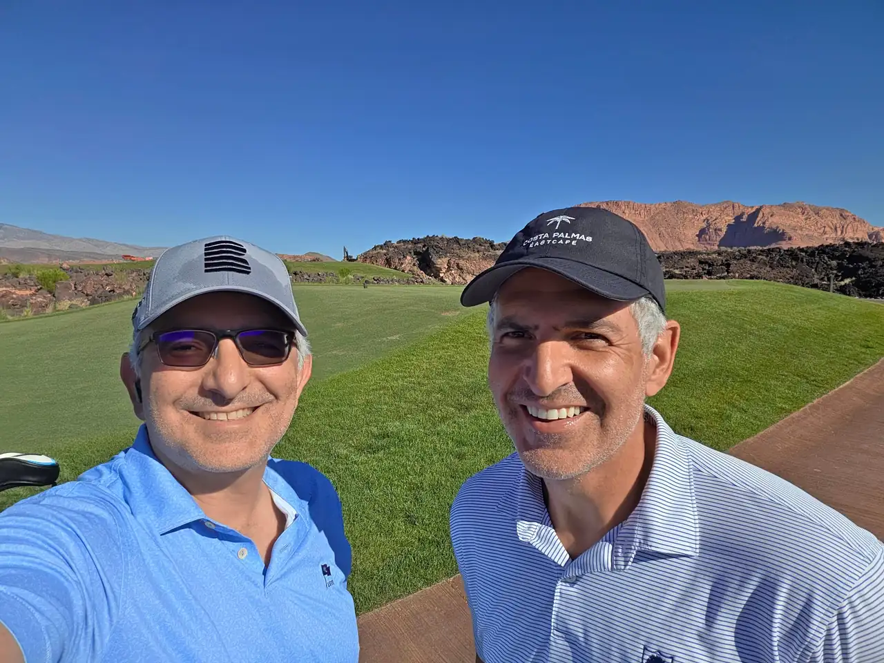 The Perry Bros with the red rock and lava fields of Black Desert Resort behind them