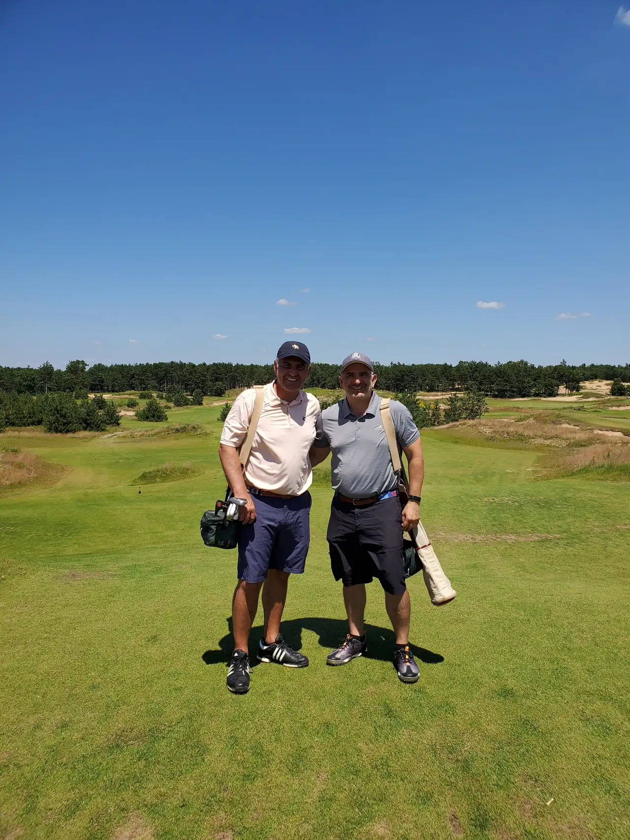 The Perry Bros carrying their bags at Sand Valley Golf Resort, Wisconsin