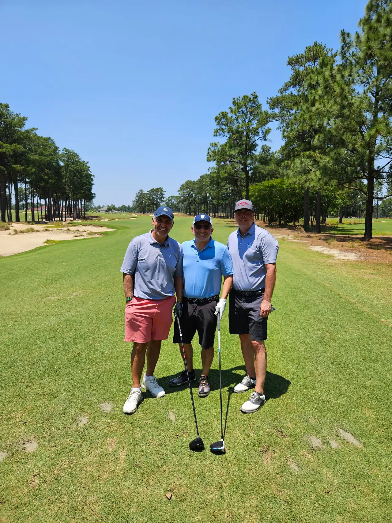 The Perry Bros and Brandon on a tee at Pinehurst No. 4 under a clear sky