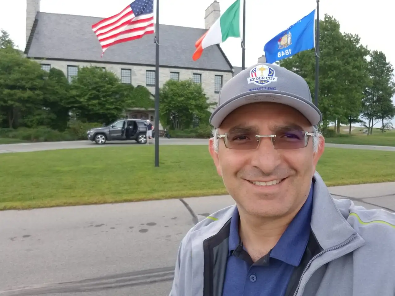 Jon Perry by the flags outside the Whistling Straits clubhouse