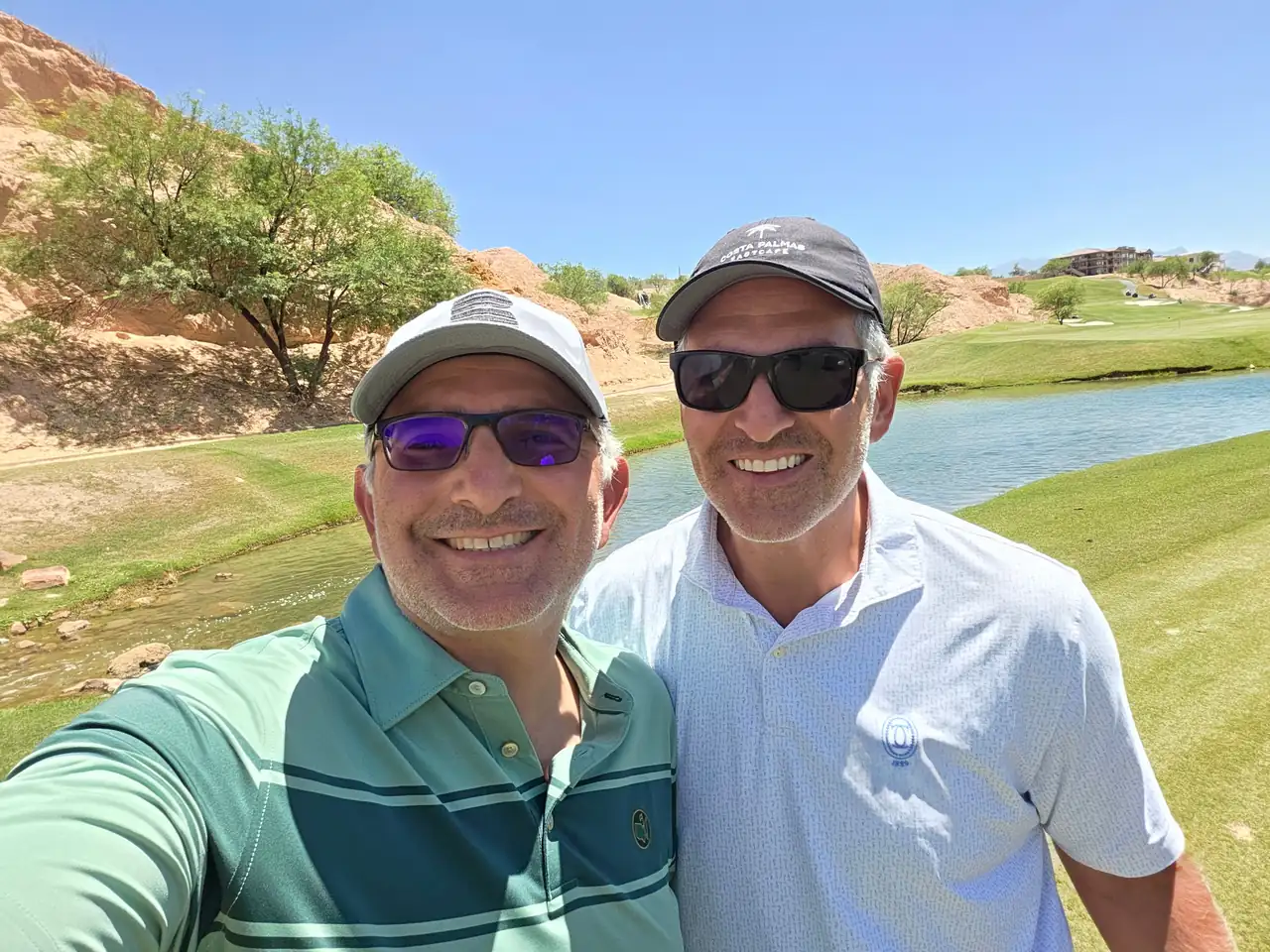 The Perry Bros by the water and red rock at Wolf Creek Golf Club in Mesquite, Nevada